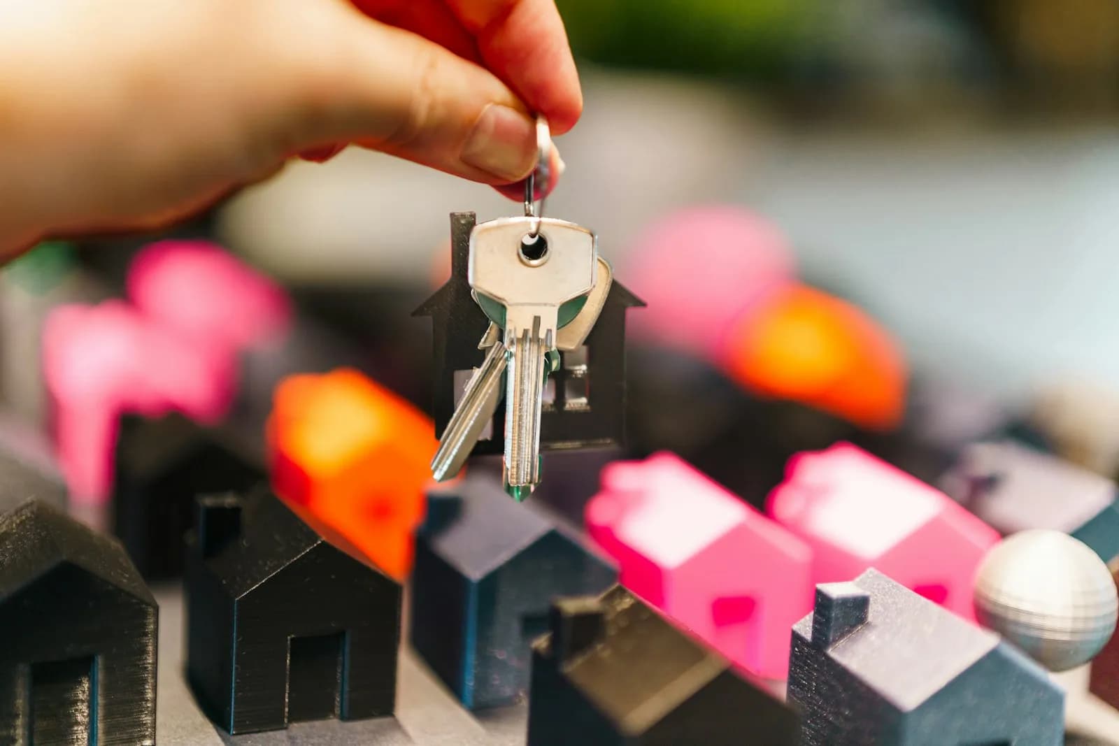 Rental apartment keys over miniature house models